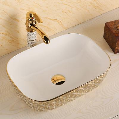 China Good Quality Double-flush Gold Plated Bathroom Art Basin Table Top Wash Hand Sink for sale