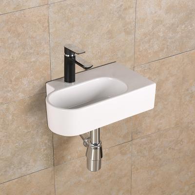 China Easy Clean Custom Ceramic Corner Bathroom Sink Solid Exterior Wall Hung Wash Basin for sale