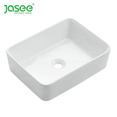 China Modern Luxury Ceramic Round Basin Bathroom Artistic Hanging Sinks for sale