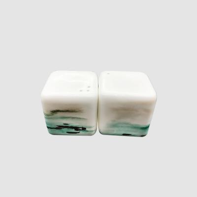 China New Arrival Sustainable Bone China Ceramic Salt And Pepper Shakers With Adjustable Pour Holes Spice And Pepper Shaker for sale