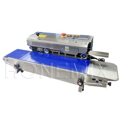 China Máquina de sellado de película de plástico horizontal de 600 W de calefacción eléctrica sellador de bolsas de plástico en venta