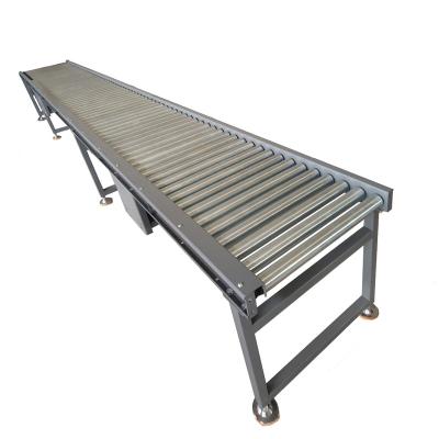 China Heat Resistant Cardboard Transport Ribbed Belt Driven Flexible Steel Roller Conveyor for sale