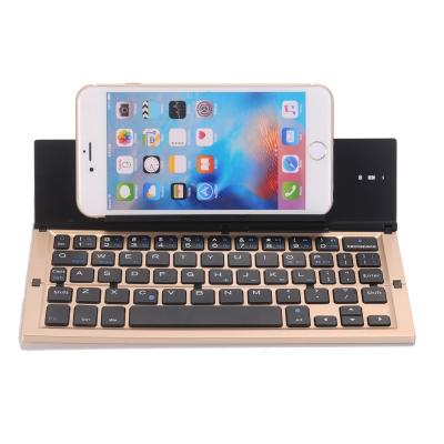 China Small Wireless Pocket Folding Pegable Teclado Wireless Keyboard with Phone Holder for sale