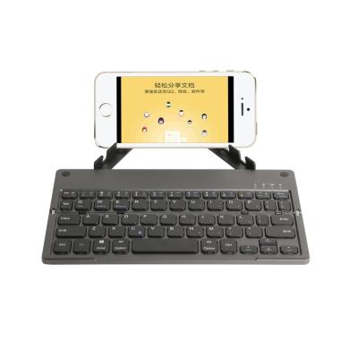 China Dual Fold Wireless Multi Media Wireless Keyboard With Phone Tablet Stand for sale