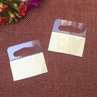 China Delta Hole Adhesive Wholesale Hang Tag Plastic 38x38mm Packaging Hang Tag for sale