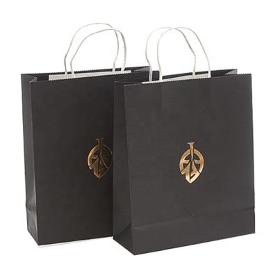 China Recyclable Luxury Black Kraft Paper Garment Garment Packaging Paper Bags For Clothes for sale