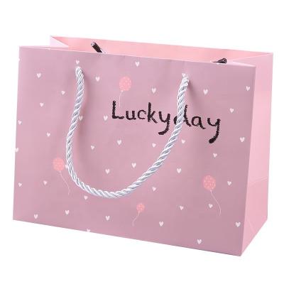 China Recyclable Garment Package Garment Paper Bag Fashion Shopping Custom Clothing Packaging Printing Pink Garment Bag for sale