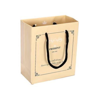 China Manufacturer recyclable design high quality china kraft paper bag made clothes packaging paper bag and gift carry bag for sale