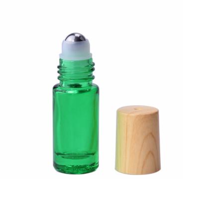 China Eco-friendly recyclable bamboo empty cap roll on glass tube 5ml rollerball perfume bottle with bamboo lid for sale