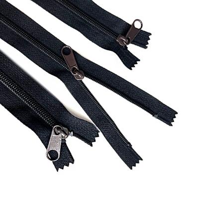 China OEM Nickel Free High Quality Black Band Non Lock Clogged Nylon Brass Paint 4# Nylon Slider Zippers Zipper For Garment Bags for sale