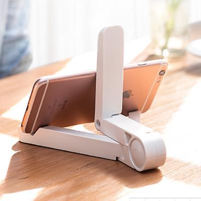 China Good Selling Portable Adjustable Folding Triangle iPad Tablet Phone Stand For Desk Bed Laptop Phone Stand for sale