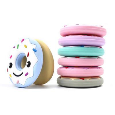 China Soft Toy Round Donuts Design Soft Silicone Newborn Baby Food Grade Chewable Teether Toy for sale