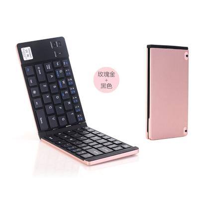 China Custom Wireless Portable Slim Pink Folding Foldable Keyboard For Tablets for sale