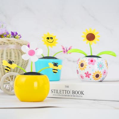 China Flower Logo Solar Dancing Flowers Solar Hot Sales Customized Flower Toy For Car Decor for sale