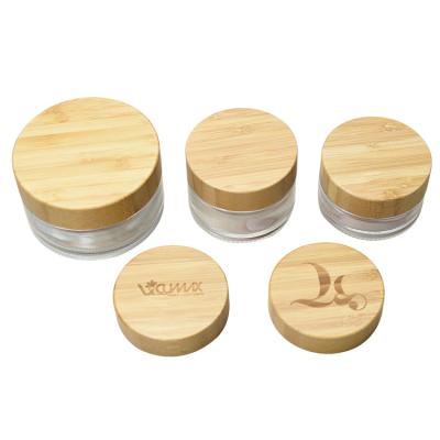 China Personal Care 100g 50g 30g 15g 5g Transparent Cosmetic Cream Jar Bamboo Lid Glass Bottle for sale