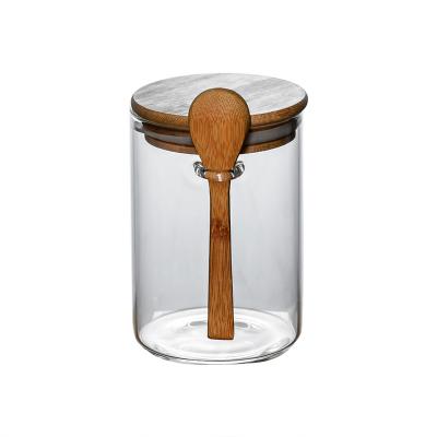 China Sustainable Round Glass Sealed Box Coffee Bean Storage Tank Kitchen Household Teapot With Wooden Spoon for sale