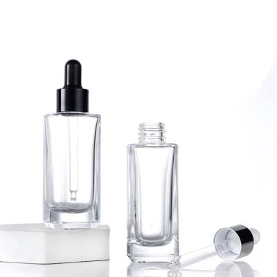 China Wholesale 30ml Eco-friendly Recyclable Clear Square Perfume Essential Oil Serum Glass Cosmetic Dropper Bottle for sale