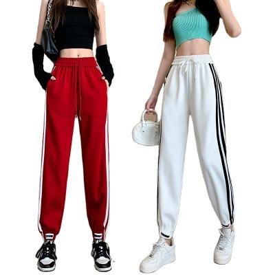 China Anti-wrinkle new 2023 spring fashion stripe spliced ​​casual sports pants loosen and slim flexible Harlem pants for women for sale