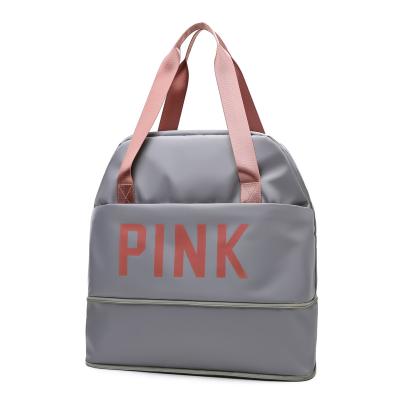 China Custom Lightweight Pink Logo Duffle Bag Travel Luggage Bag Overnight Bag Extra Large Capacity Waterproof for sale