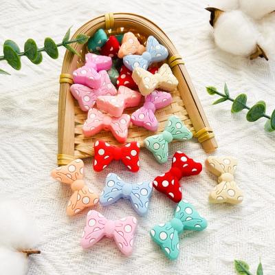 China Toy New Bow Tie Soft Silicone Beads Bowknot Food Grade Silicone BPA DIY Pacifier Clip Baby Accessories Free Teether Toy for sale