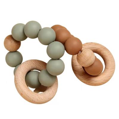 China Soft Toy Baby Shower Gift Beech Wood Baby Teether For Mouth Exploration Baby Teether Silicone Wooden Toy for sale