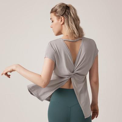 China Breathable Quick Dry Women's Sexy Backless Yoga Shirts Yoga Cross Tops Breathable Short Sleeve Gym Shirts for sale