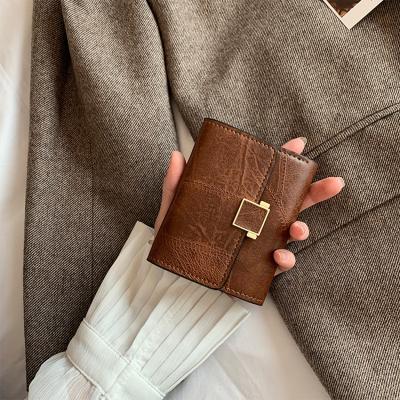 China Custom Wholesale Waterproof Famous Brands Fashion Women's Retro Short Purses Custom Pu Small Coin Leather Wallet Card Holder Girls Mini Purse for sale