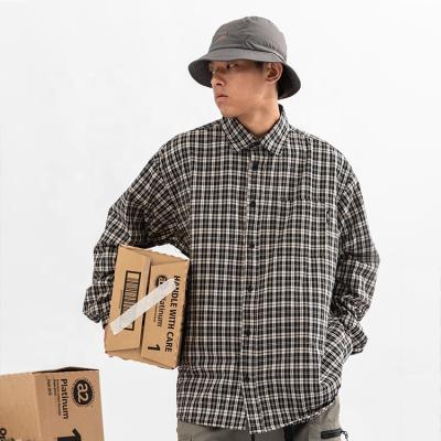 China Men's Loose Autumn Casual Curved Hem Shirts Plaid Lapel Shirts Long Sleeved Breathable Safari Style Shirt Men for sale