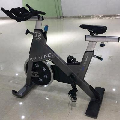 China Commercial Use IN STOCK Indoor Commercial Bike Cycle Cardio Exercise Spinning Bike With Monitor Flywheel 20 Kg for sale