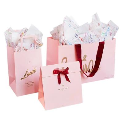 China Recycled materials 2021 new white card custom packaging shopping bag, custom logo pink paper bolsa papel with ribbion for sale