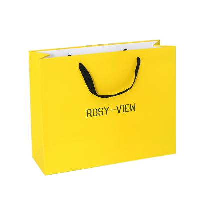 China New Recycled Materials Packaging Carrier Bags, Custom Logo Printed Shopping Gift Paper Bag For Wholesale for sale