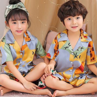 China 2020 Wholesale Kids QUICK DRY Baby New Cartoon Satin Design Kids Clothes Christmas Children Pajamas Unisex Set for sale