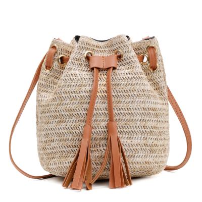 China Fashionable Low Price Guaranteed Quality The New Tassel Packet Bucket Straw Bag Chains Ladies Messenger Bag for sale