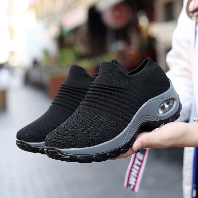 China Fashion Breathable flyknit fabric spring and summer flat women casual sneakers sports walking style shoes for sale