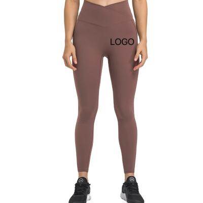 China Breathable OEM yoga leggings feature a v waist with a stylish v cut and a unique cross waist design. for sale