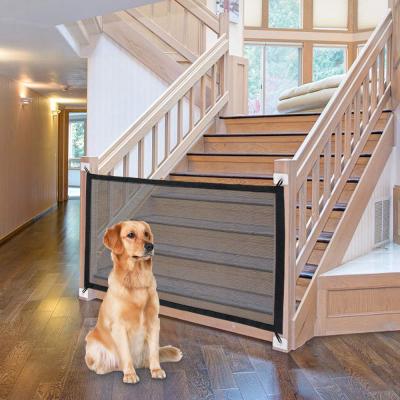 China Indoor Pet Safety Mesh Dog Gate Portable Folding Stored Dog Barrier for sale