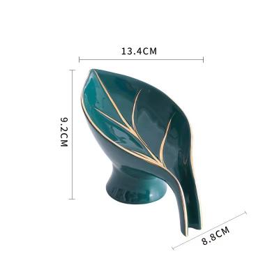 China Sustainable Ceramic Leaf Shaped Soap Box Toilet Suction Cup Drain Sanitary Ware Rack Dish Laundry Soap Box for sale