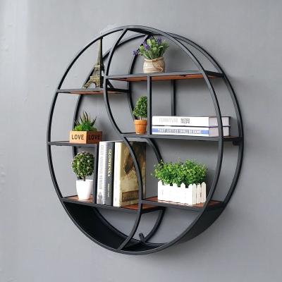 China Creative Living Room Partition Wall Shelf Decoration Display Stand Wrought Iron Round Solid Wood Shelf Adjustable (Height) for sale