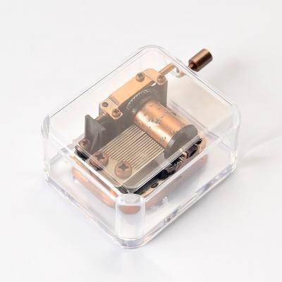 China Mini Music Box New Acrylic Popular Interesting Hand Crank Music Box for sale