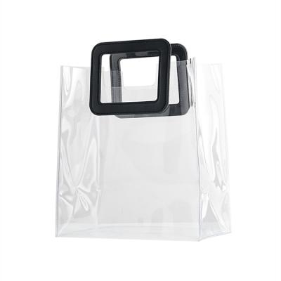 China Reusable Transparent High End Cosmetic Bag PVC Shopping Packaging Gift Tote Bag Customized Souvenir Gift for sale