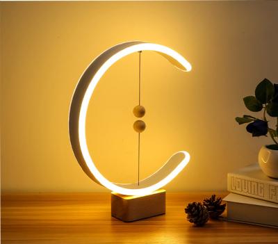 China 2021 Modern USB Battery Charging Led Balance Magnetic Modern Creative Wood Lamp Desk Table Smart Magnetic Pendant Lamp for sale