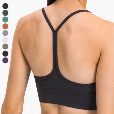 China Strappy Sports Bra Strappy Design Yoga Sports Bra Women Fitness Yoga Tops Detachable Thin Breathable Chest Pad for sale