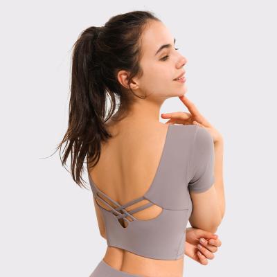 China Breathable Sexy Backless Short Sleeve Removable Padded 2 Piece Yoga Tops Gym Fitness Yoga Sports T-Shirt for sale