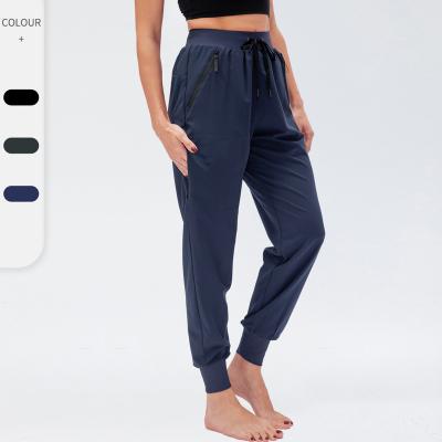 China 2022 Breathable Women Stretch Side Pocket Drawstring Design Women Pants High Waisted Casual Pants Workout Pants for sale