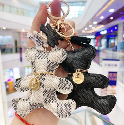 China Wholesale PU Leather Keychain Lattice Metal Holder Cartoon Bear Car Key Chain Pendant Key Chain New for sale