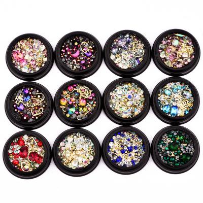 China Eco-friendly hot nail supplies 1 box mixed laser shine stones 3D crystal rhinestone and alloy nail fancy decorations for sale