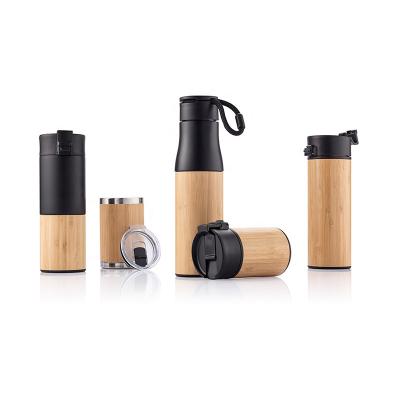 China 500ml Double Wall Stainless Steel Sustainable Bamboo Case Water Bottle With Handle Rope Eco Friendly Sports Drinking Bottle for sale