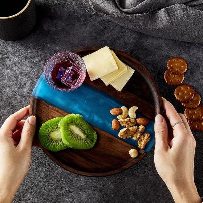 China Sustainable Custom Hot Selling Decorative Round Black Walnut Wood And Resin Serving Tray For Candy Cafe Cheese for sale