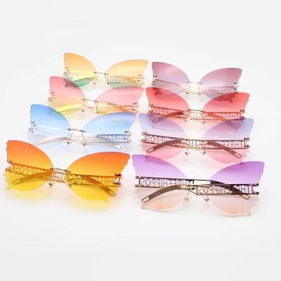 China QH 10106 High Quality New Fashion Metal Rimless Woman Sunglasses Trend Butterfly Shades Party Colored Sun Glasses for sale