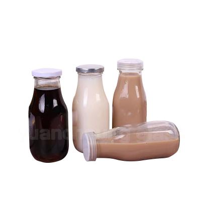 China 300ml Glass Food Drink Bottles Wholesale Empty Milk Juice Bottles for sale